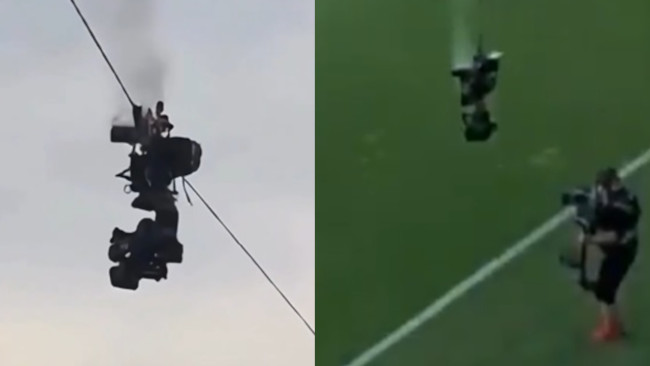 Een camera stort midden in een voetbalwedstrijd op de grond en ontsnapt ternauwernood aan een ramp