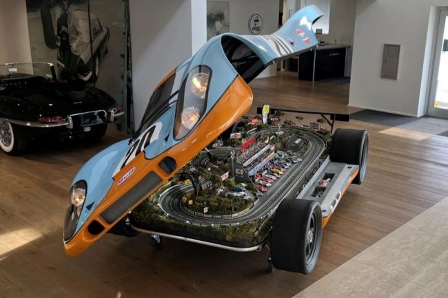 This slot car raceway is mounted in the Porsche 917 from Le Mans